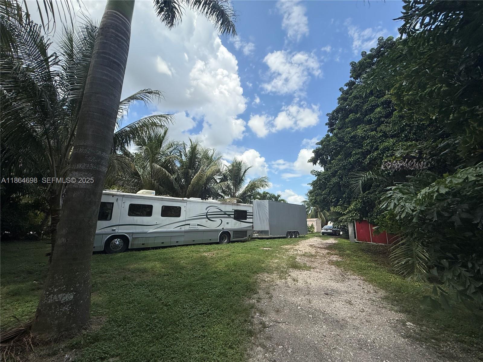15765 Southwest 206th Avenue Miami, FL 33187 - Photo 6 of 57 a view of a house with a yard