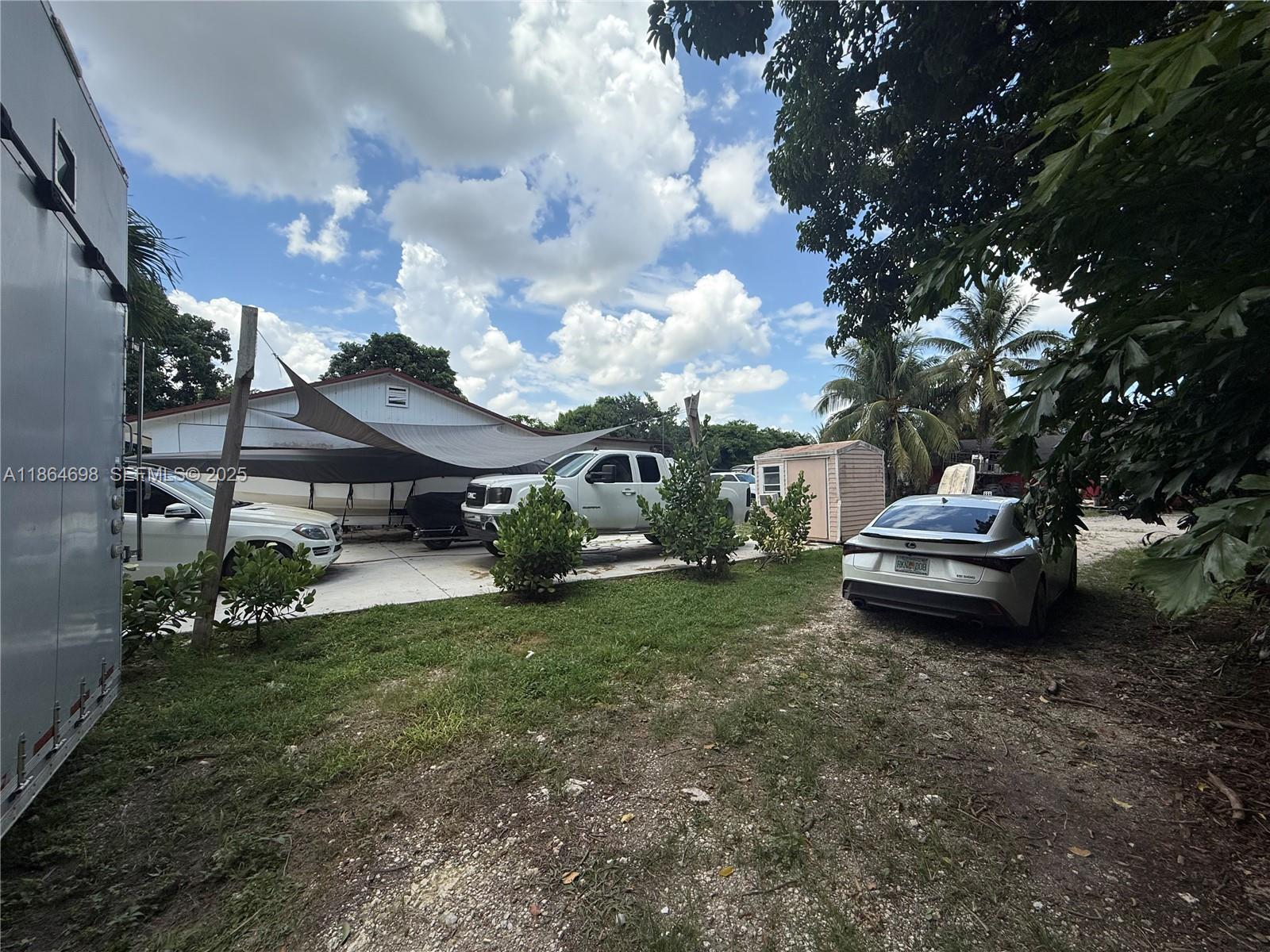 15765 Southwest 206th Avenue Miami, FL 33187 - Photo 10 of 57 a big house with a yard