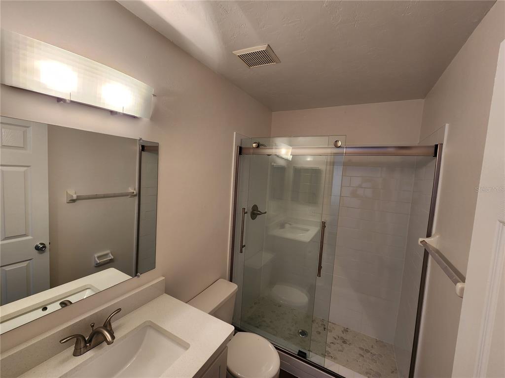 5823 Southwest 9th Place, Unit H55 Gainesville, FL 32607 - Photo 35 of 50 a bathroom with a sink toilet and shower