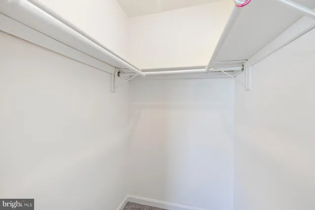 a view of a room with racks on the wall