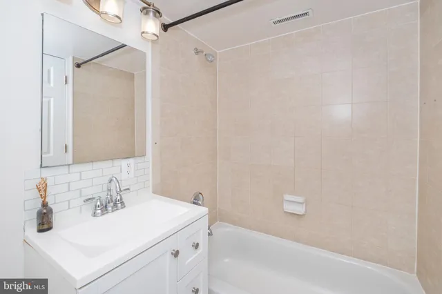 a bathroom with a sink and a bathtub