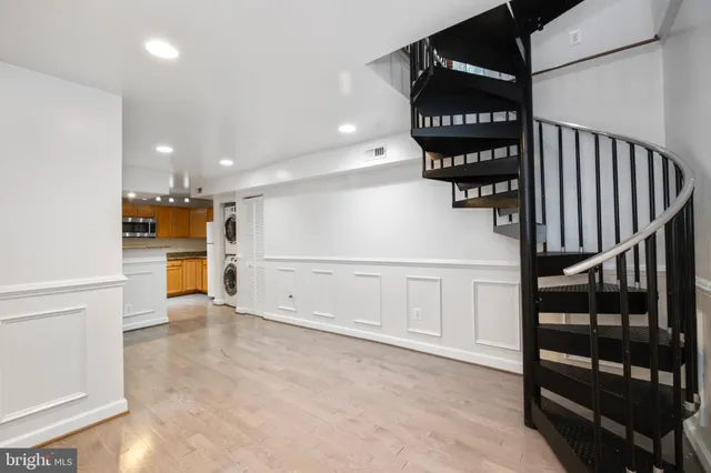 a view of an entryway with a kitchen