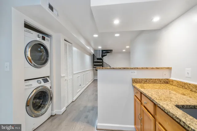 a view of a kitchen with washer and dryer