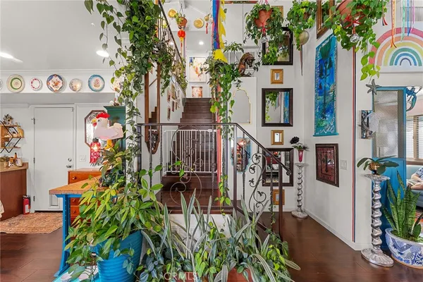 an workspace with furniture and painting on the wall