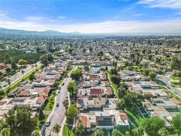 an aerial view of residential houses with outdoor space