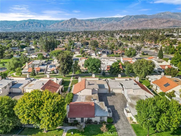 an aerial view of residential houses with outdoor space