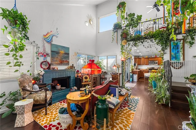 an outdoor living space with furniture and a fireplace