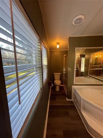 a view of a balcony with two chairs