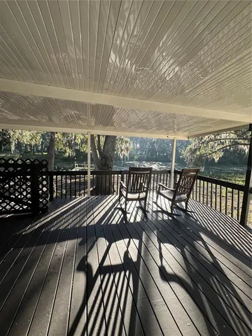 a view of a balcony with furniture