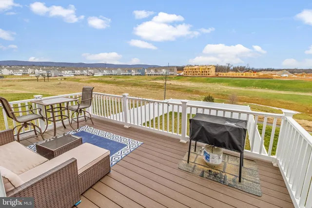 a view of a terrace with wooden benches