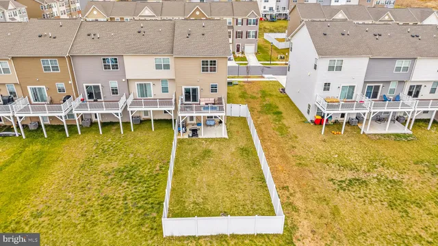 a swimming pool with outdoor seating and yard