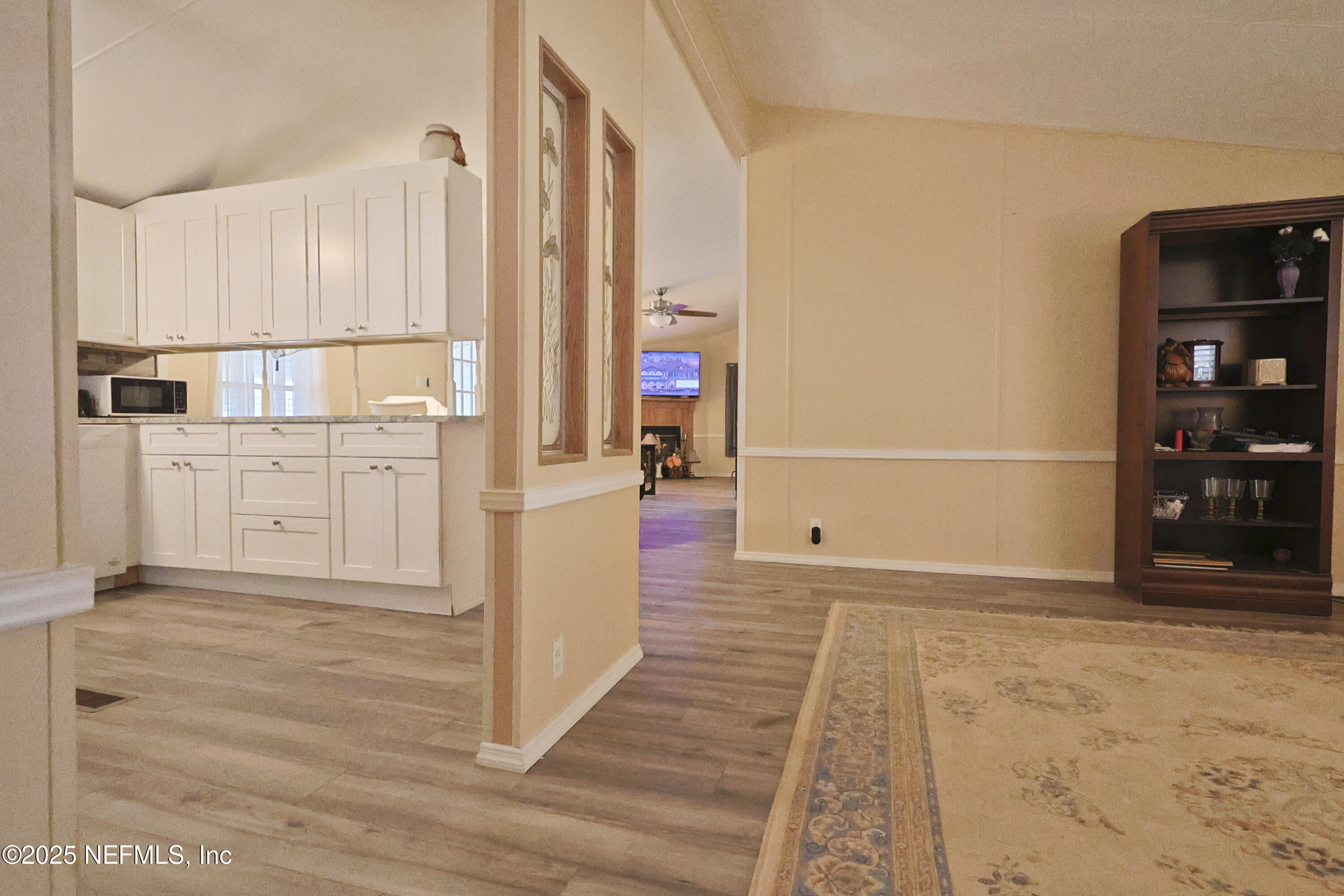 138 Edgewater Road Satsuma, FL 32189 - Photo 20 of 45 a view of a kitchen with white cabinets