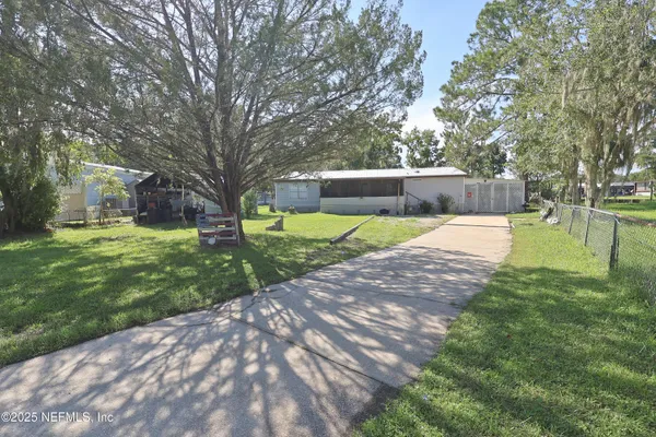 a view of a backyard with green space