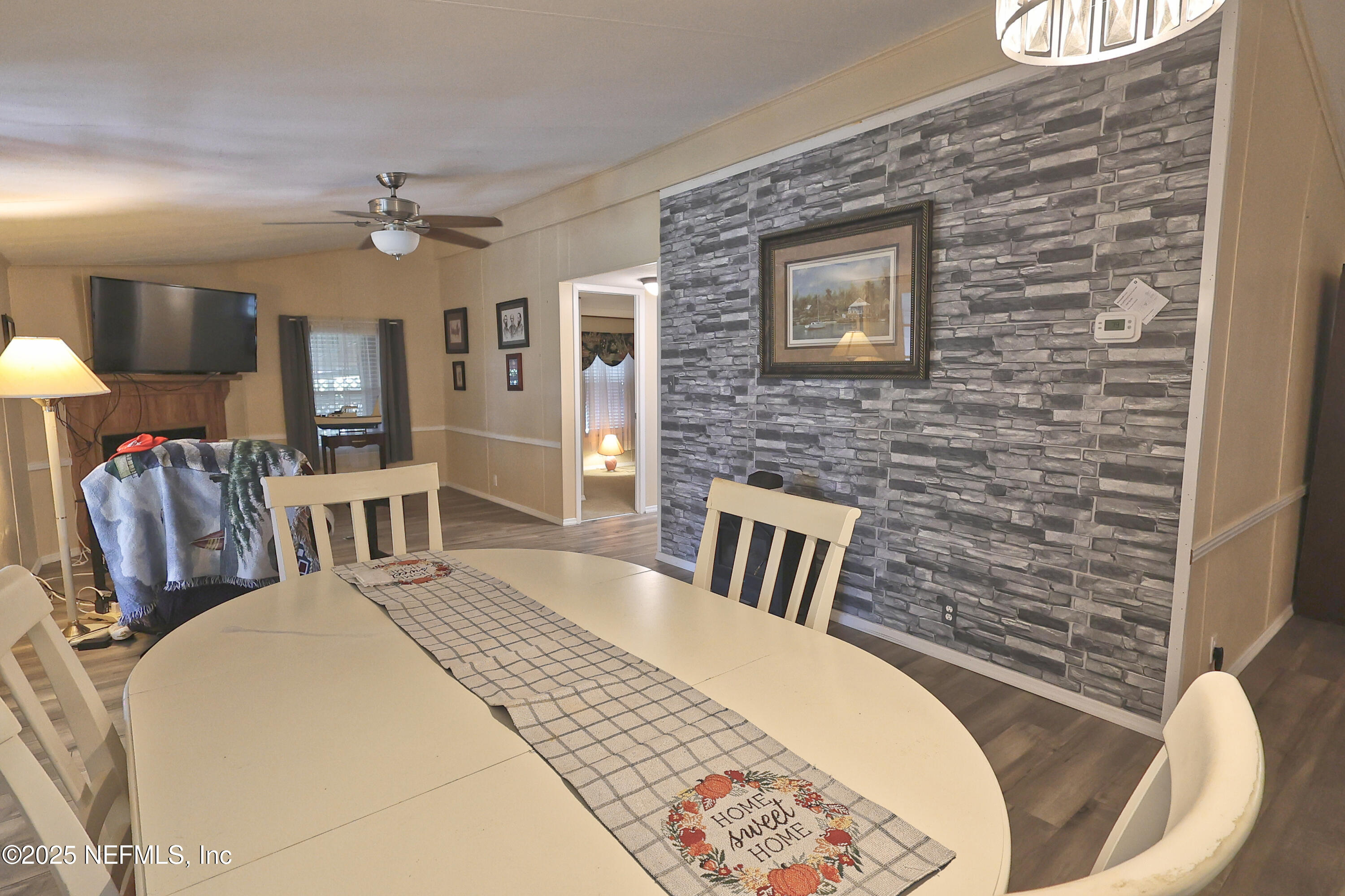 138 Edgewater Road Satsuma, FL 32189 - Photo 23 of 45 a spacious bedroom with a bed dresser and a chair