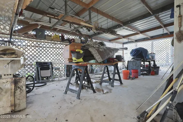 a view of a garage with a table and chairs