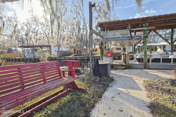 a view of a park with sitting area