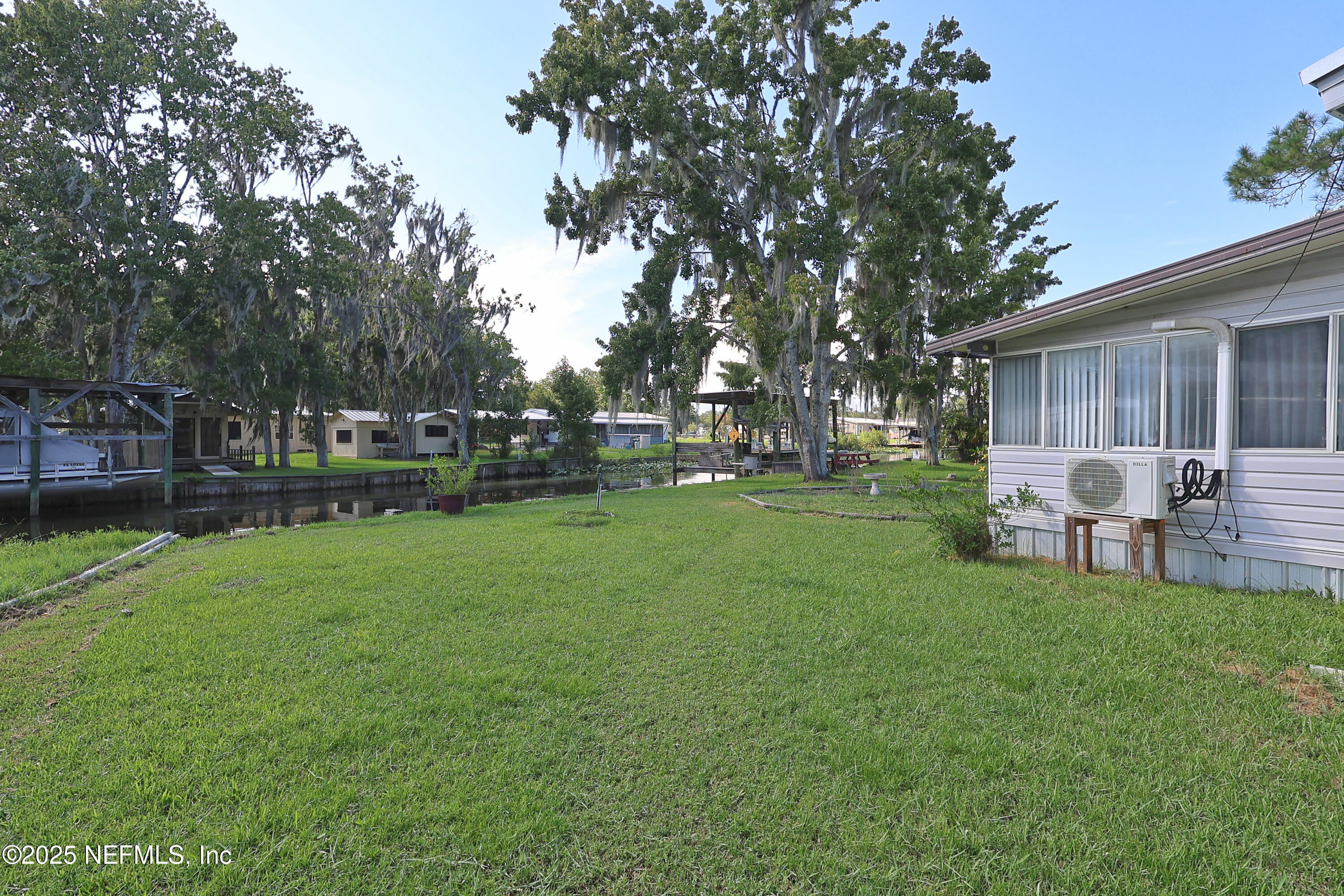 138 Edgewater Road Satsuma, FL 32189 - Photo 6 of 45 a view of a backyard with sitting area