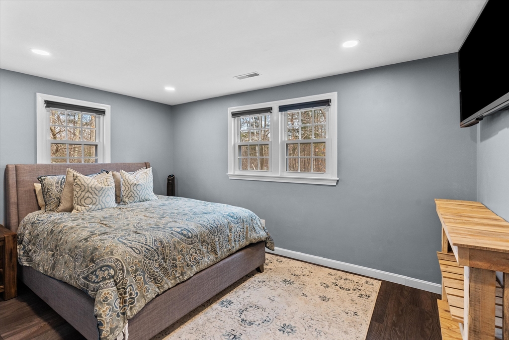 8 Gelding Road Chelmsford, MA 01824 - Photo 28 of 40 a bedroom with a bed and a flat screen tv