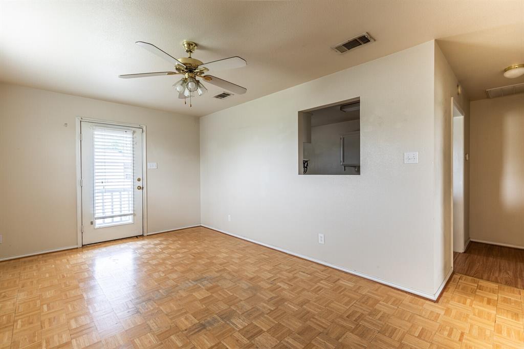 520 Live Oak Street Meridian, TX 76665 - Photo 4 of 9 an empty room with windows and fan