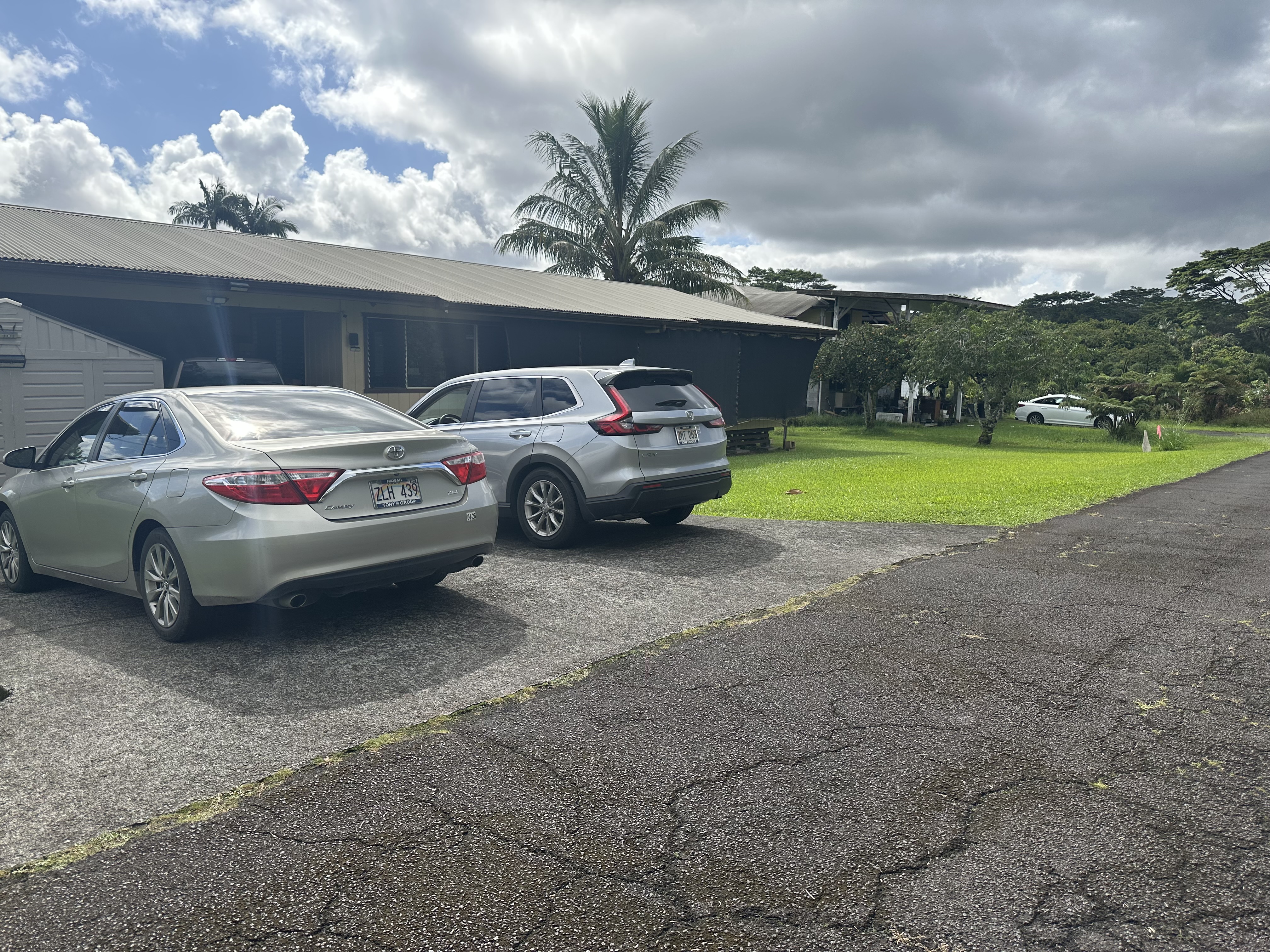 a view of a car parked in back of a house