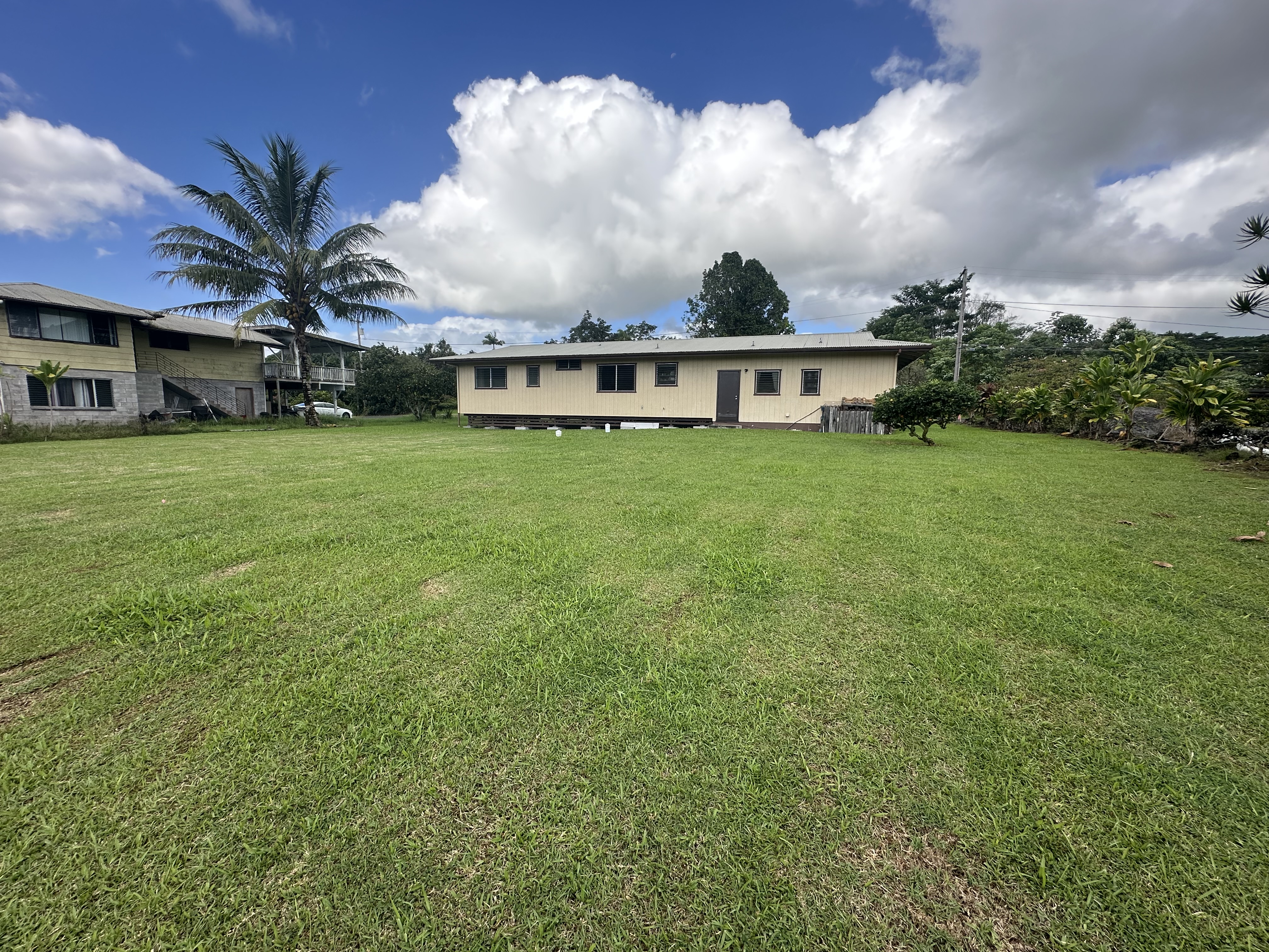 17-303 Pilikino Road Kurtistown, HI 96760 - Photo 2 of 7 a view of a house with a backyard