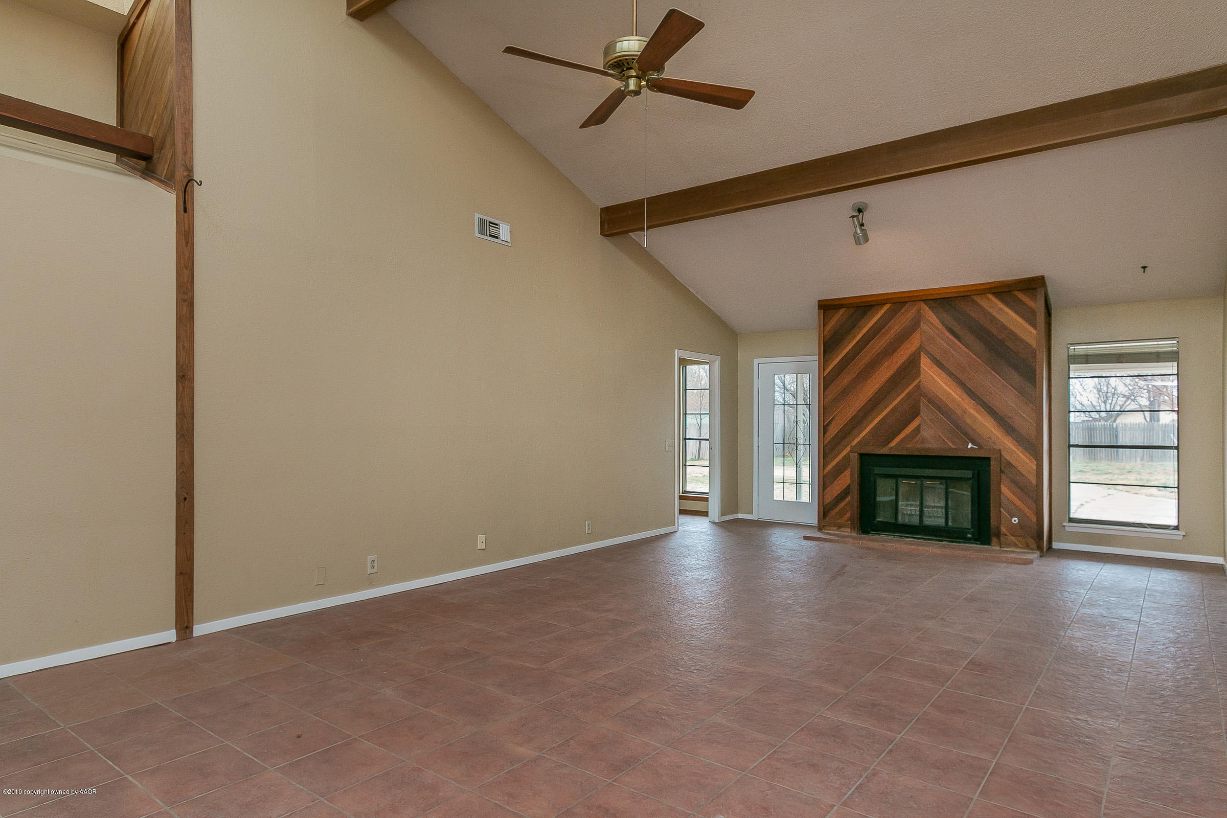 8100 Goodnight Trail Amarillo, TX 79110 - Photo 3 of 20 a view of a livingroom with a fireplace and window