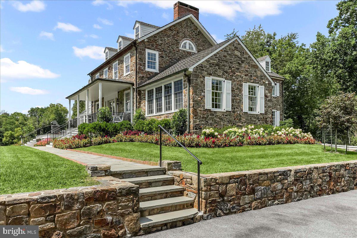 80 Heyburn Road Chadds Ford, PA 19317 - Photo 15 of 75 a front view of a house with a yard