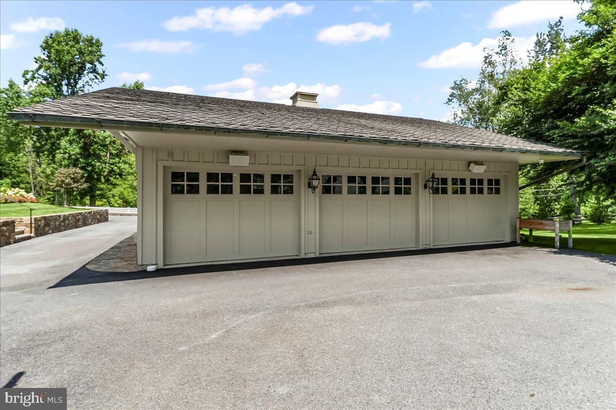 80 Heyburn Road Chadds Ford, PA 19317 - Photo 16 of 75 a front view of a building with a garage