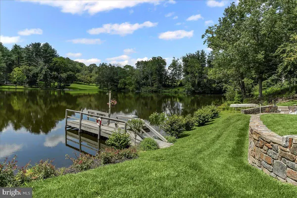 a kitchen with granite countertop white cabinets and sink