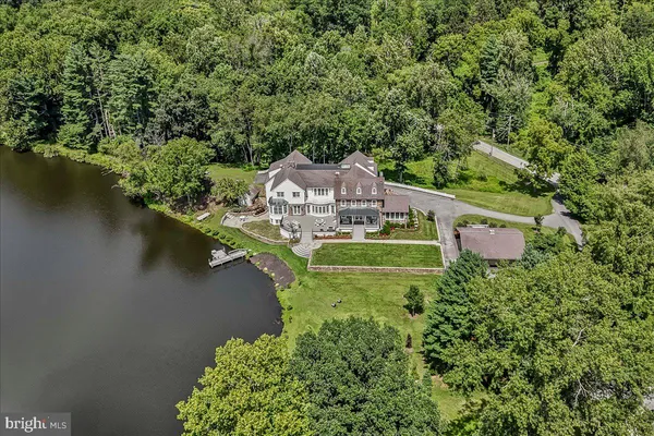 a kitchen with stove and wooden floor
