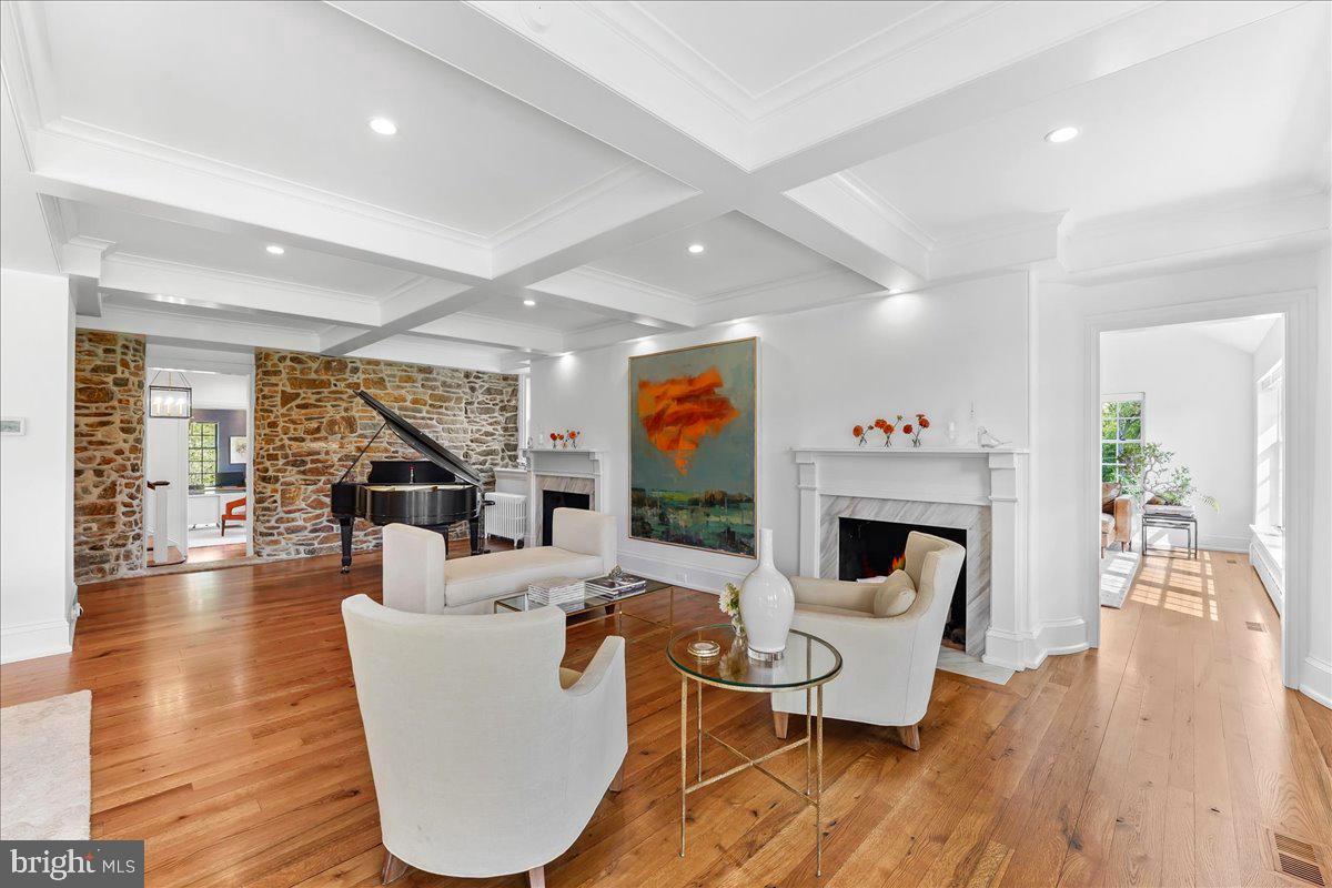 80 Heyburn Road Chadds Ford, PA 19317 - Photo 28 of 75 a living room with fireplace furniture wooden floor and a rug