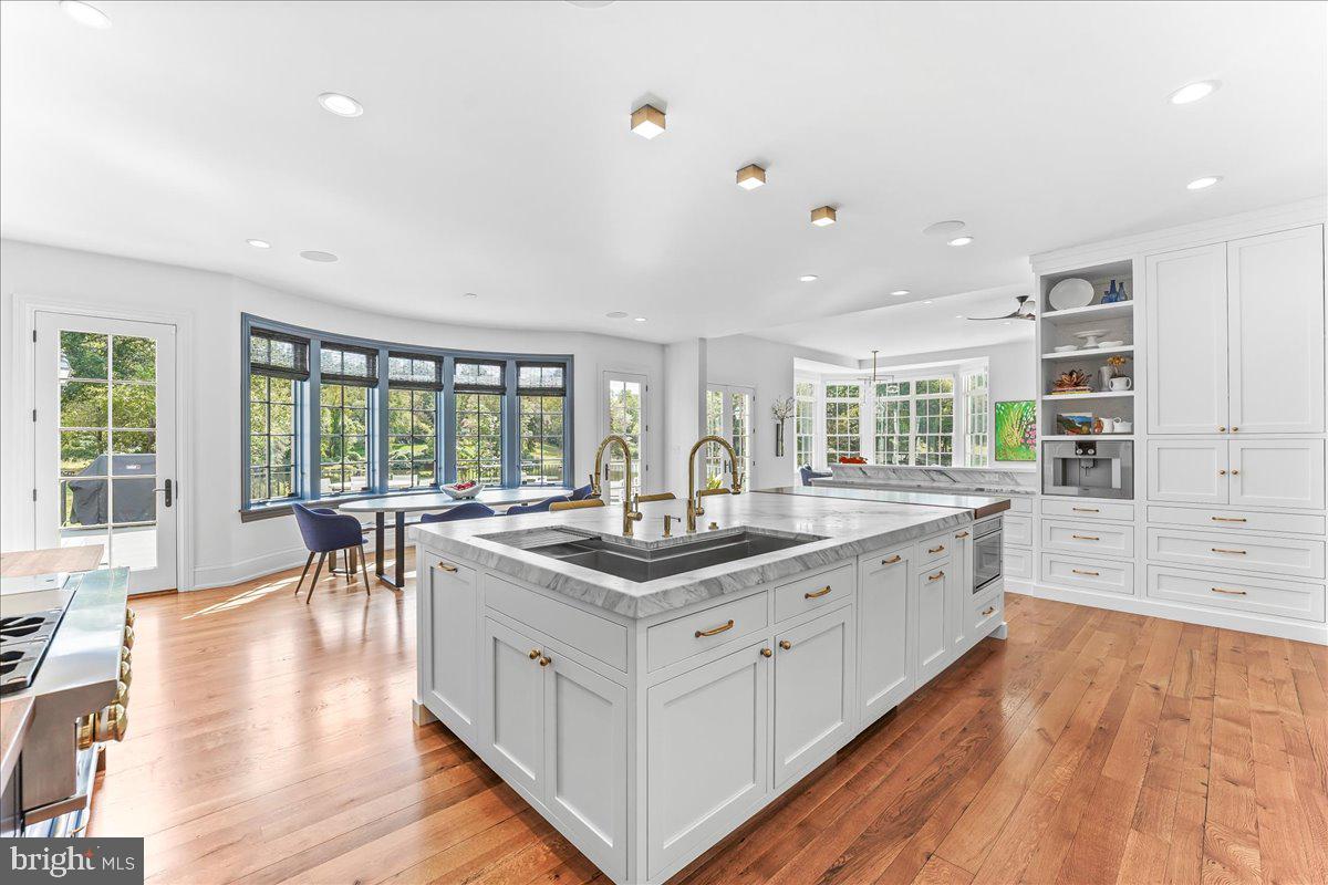 80 Heyburn Road Chadds Ford, PA 19317 - Photo 34 of 75 a kitchen with stove and wooden floor