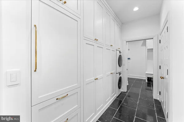 a utility room with sink dryer and washer