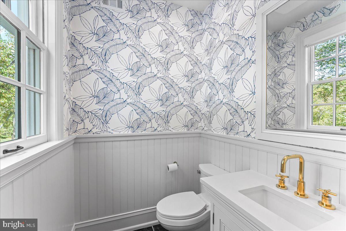 80 Heyburn Road Chadds Ford, PA 19317 - Photo 43 of 75 a bathroom with a toilet and sink