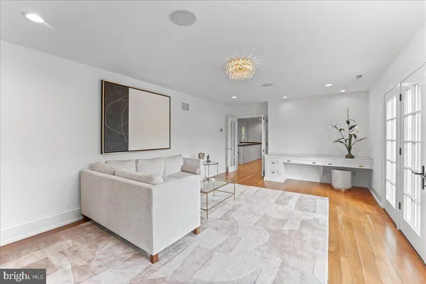 a view of house with river and trees in the background