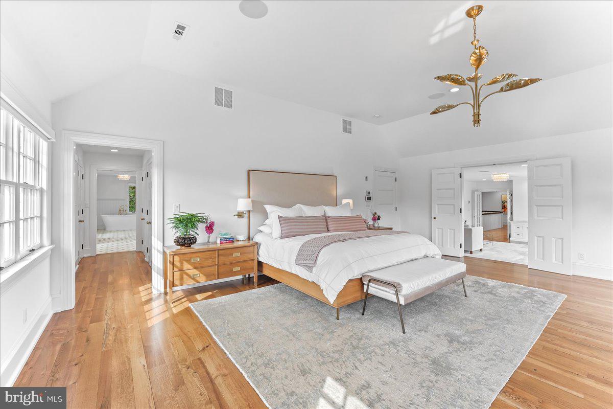 80 Heyburn Road Chadds Ford, PA 19317 - Photo 48 of 75 a spacious bedroom with a bed and wooden floor