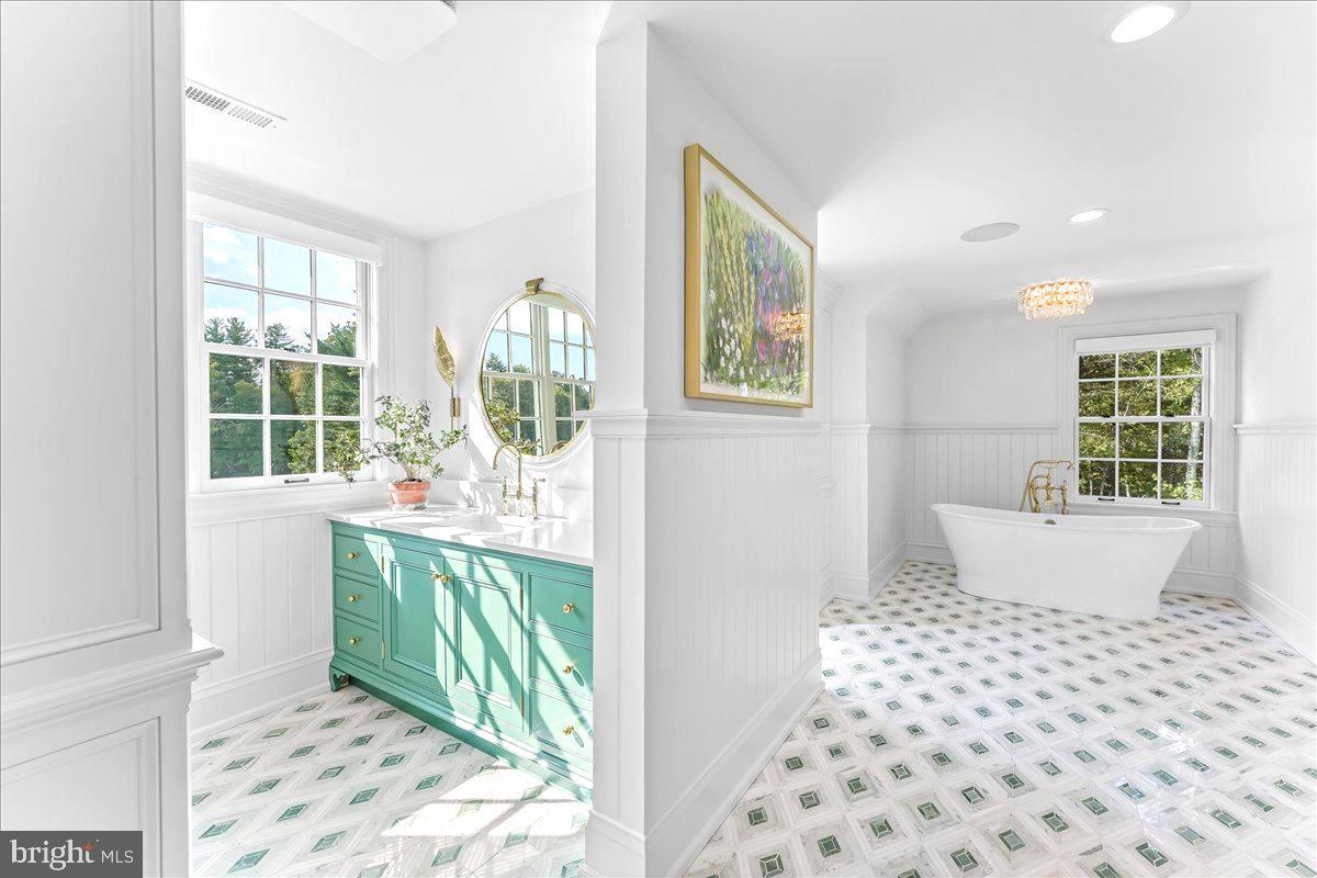80 Heyburn Road Chadds Ford, PA 19317 - Photo 49 of 75 a living room with a black white checkered floor with a dining table and chair