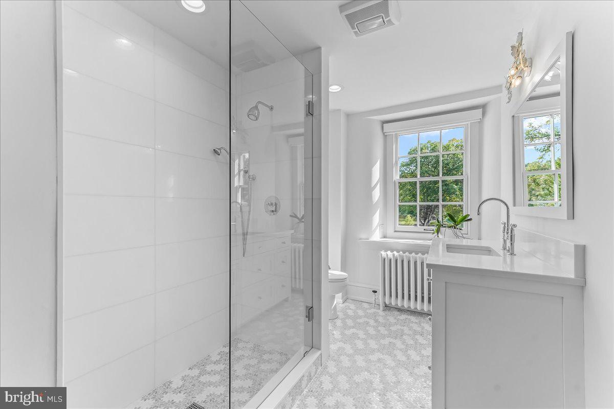 80 Heyburn Road Chadds Ford, PA 19317 - Photo 59 of 75 a bathroom with a granite countertop sink a toilet and shower