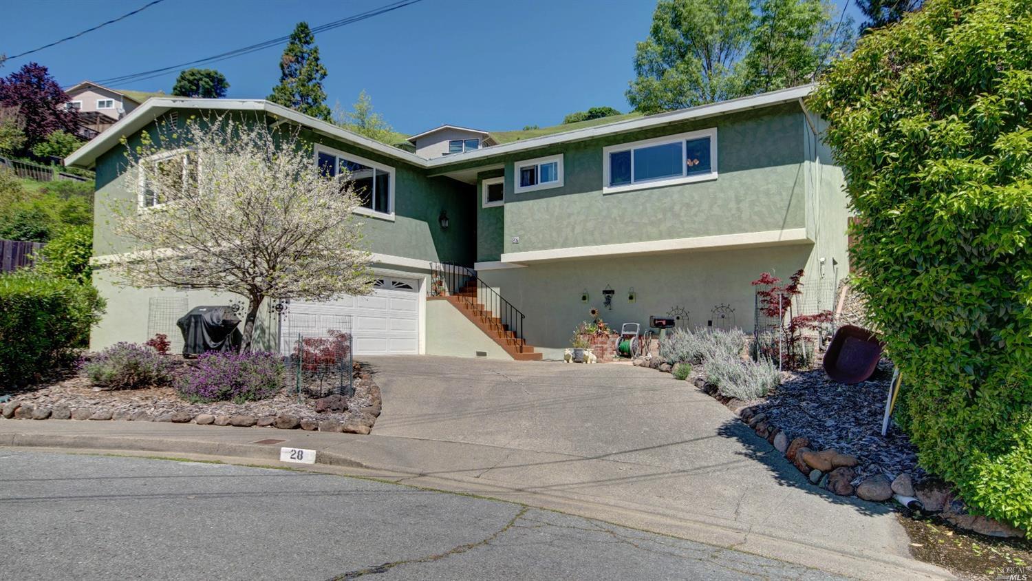 28 Tralee Way San Rafael, CA 94903 - Photo 1 of 1 a front view of a house with garage