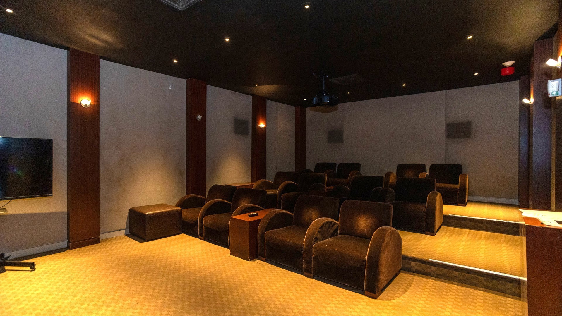 655 West Irving Park Road, Unit 3704 Chicago, IL 60613 - Photo 32 of 36 a media room with lots of chairs and a projector screen