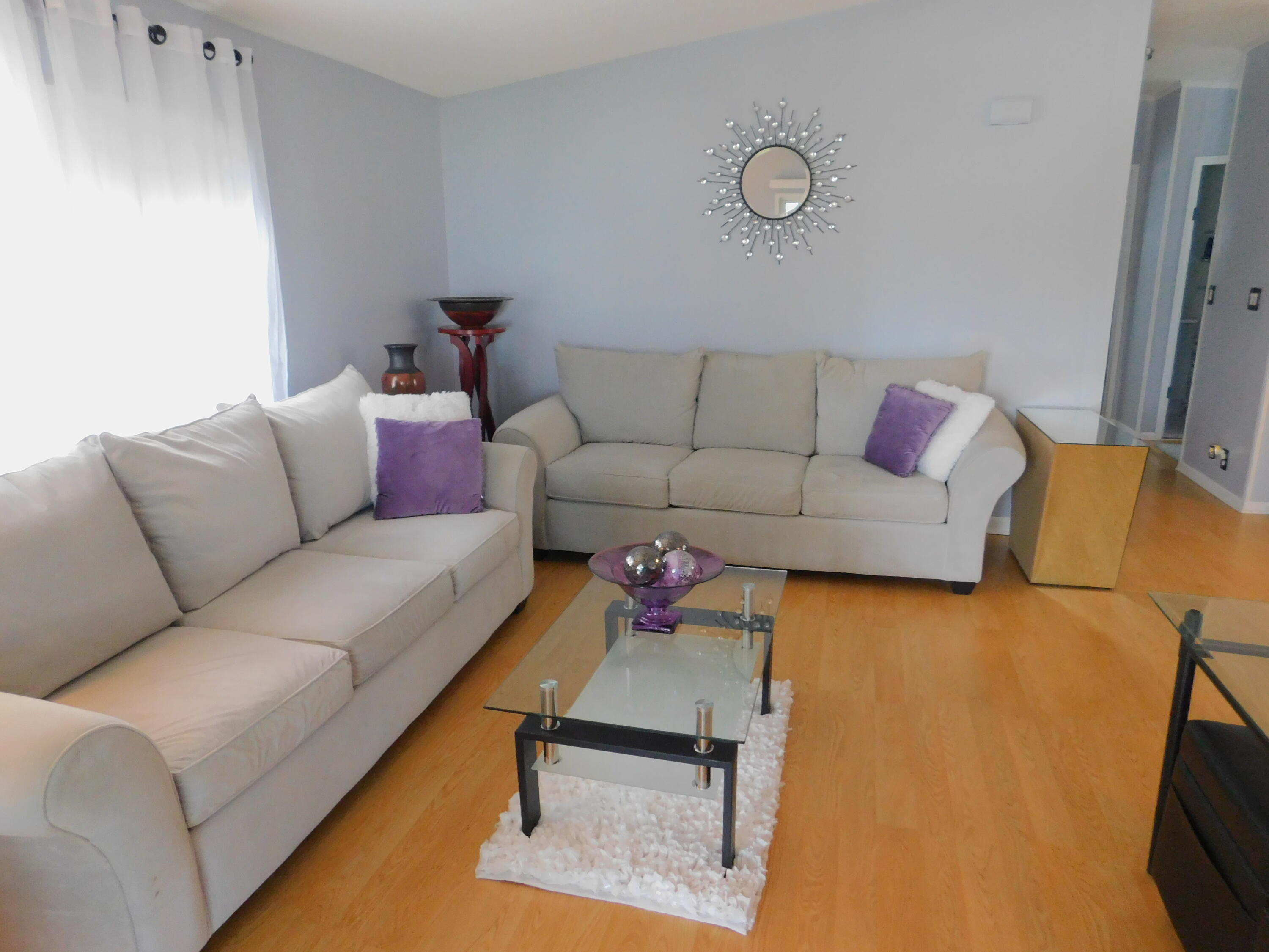 376 Seahorse Terrace Fort Pierce, FL 34982 - Photo 10 of 16 a living room with furniture and a couch