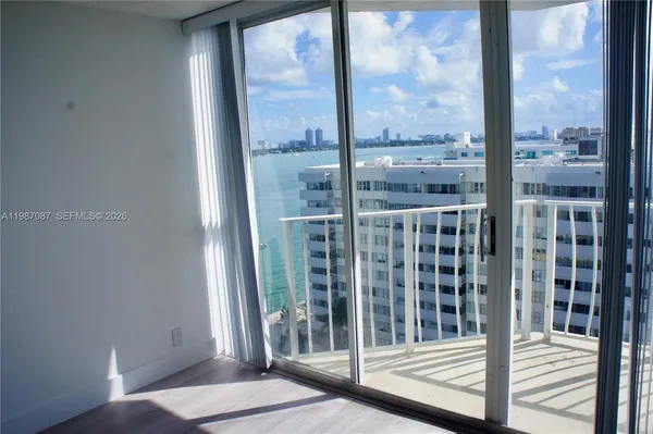 a view of a balcony with wooden floor
