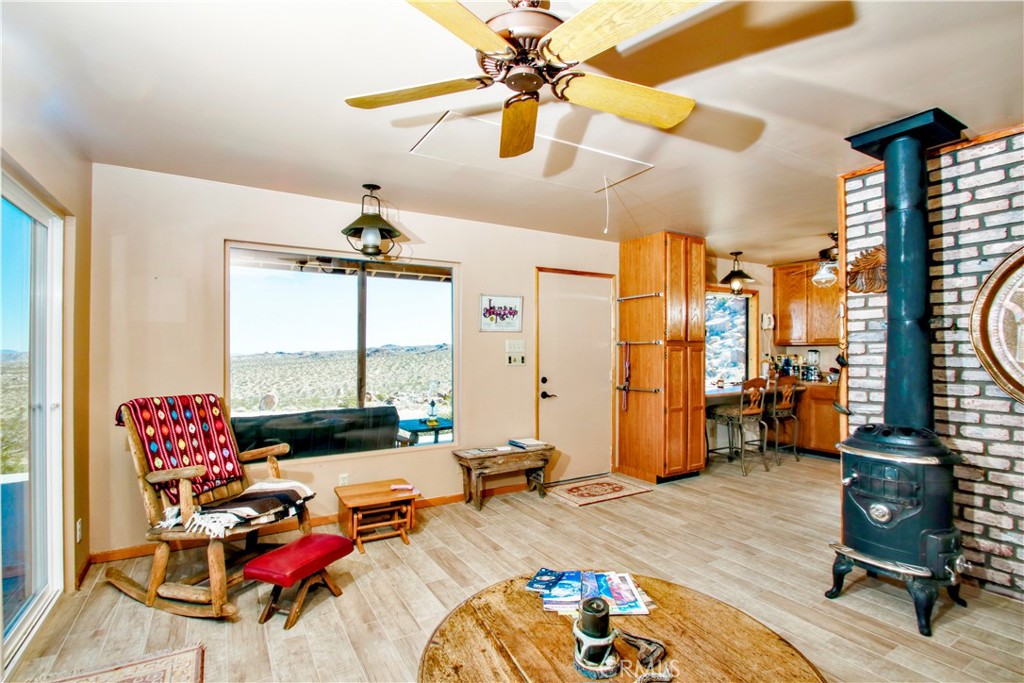 4650 Sizer Canyon Road Johnson Valley, CA 92285 - Photo 12 of 36 a bedroom with furniture and a large window