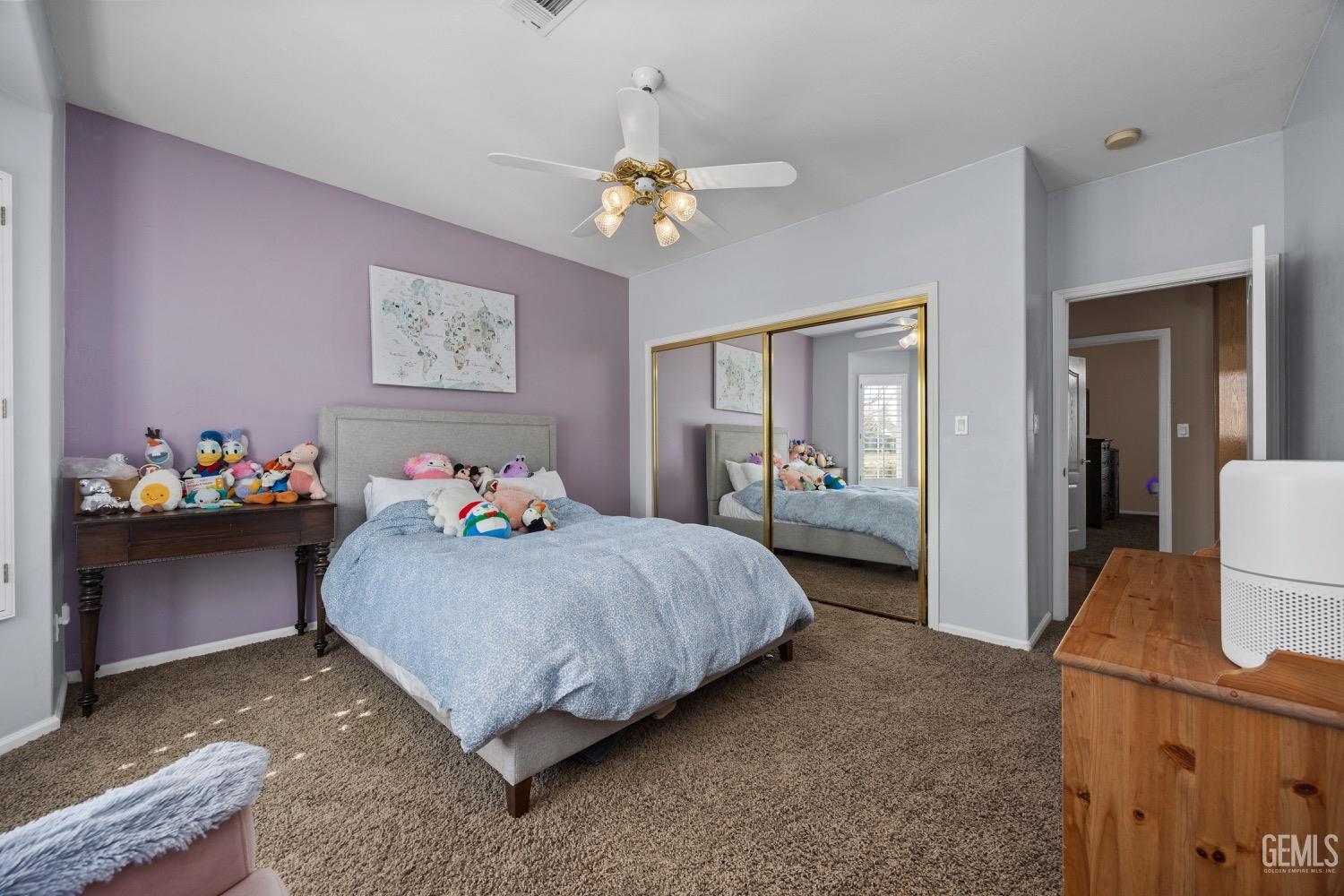 Undisclosed Address Bakersfield, CA 93314 - Photo 24 of 39 a bedroom with a bed and a chandelier