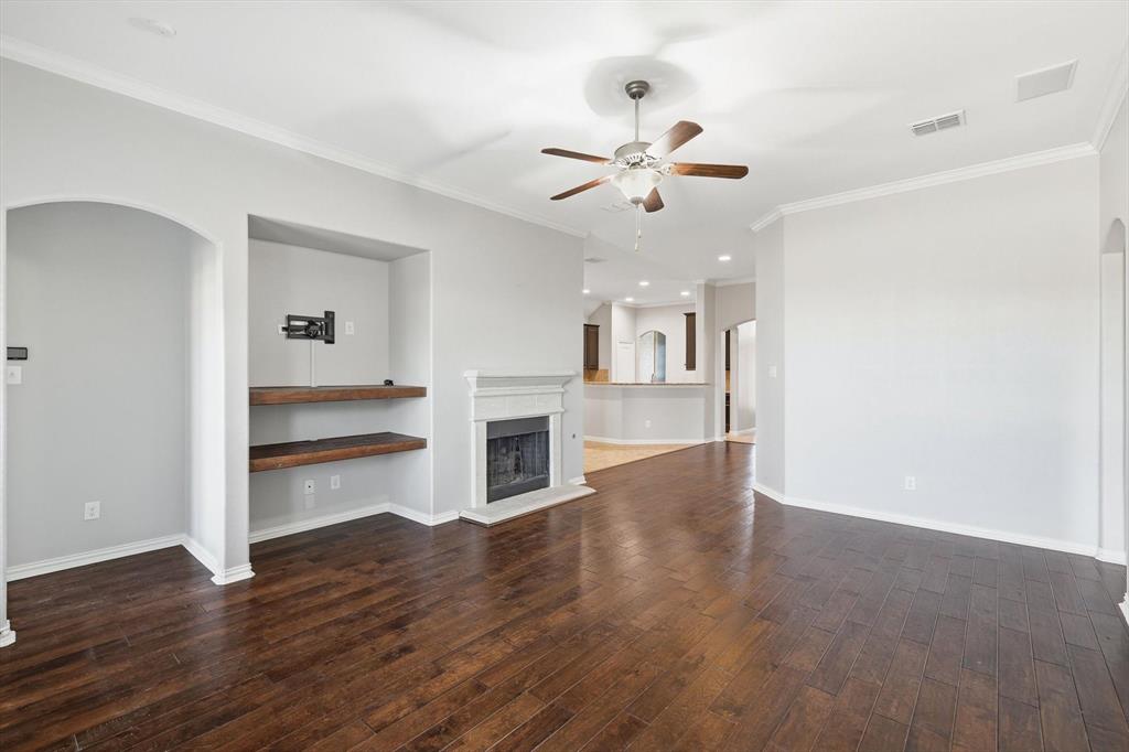 3513 Durango Root Court Fort Worth, TX 76244 - Photo 17 of 34 a view of a kitchen with wooden floor and a ceiling fan