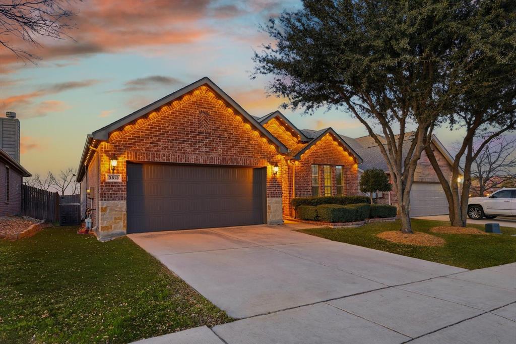3513 Durango Root Court Fort Worth, TX 76244 - Photo 2 of 34 a front view of a house with a yard and garage