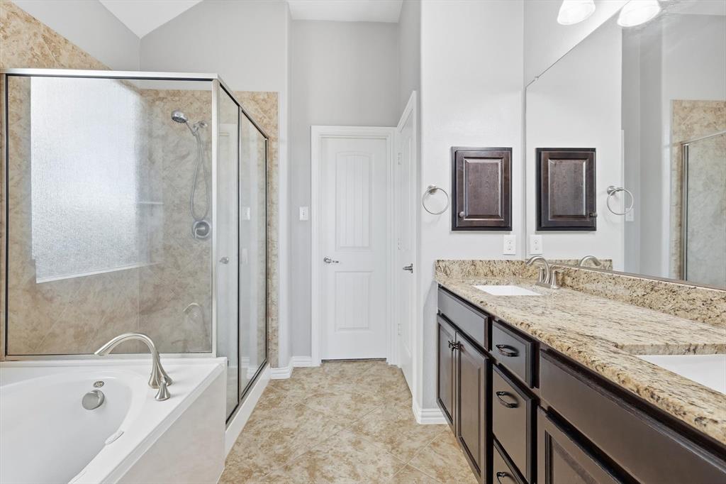 3513 Durango Root Court Fort Worth, TX 76244 - Photo 20 of 34 a bathroom with a granite countertop tub sink and mirror