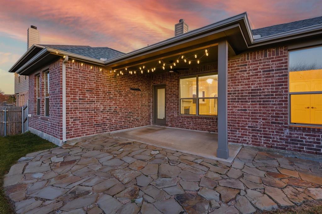 3513 Durango Root Court Fort Worth, TX 76244 - Photo 27 of 34 a front view of a house with a garage