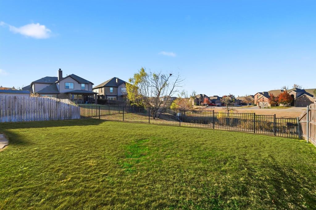 3513 Durango Root Court Fort Worth, TX 76244 - Photo 28 of 34 a view of a lake with a yard