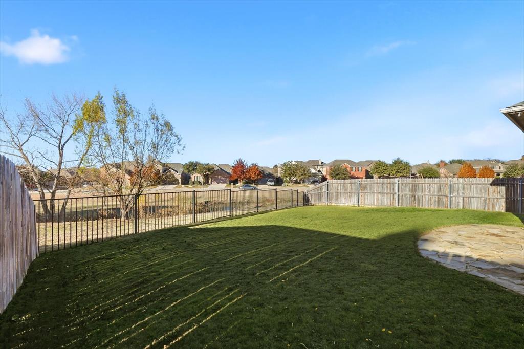 3513 Durango Root Court Fort Worth, TX 76244 - Photo 29 of 34 a view of a golf course with a lake